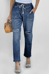 Pantalon de jogging en denim à poches rondes et vieilli bleu foncé