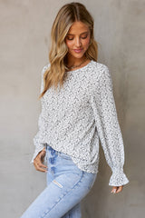 Blouse noire à manches à volants-A WOMAN WE LOVE