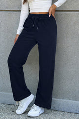 Decreeed size pants with tightening cord lined as a solid navy blue fleece