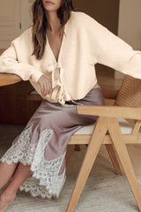 Jet stream cardigan ample knitted with butterfly knot on the front and v -neck