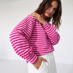 Striking pink sweatshirt and neck and falling shoulders