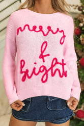 Rose knitting pink sweater with Merry & Bright pop-up letters