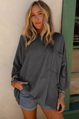 Dark grey ribbed oversized top with rolled up sleeves and chest pocket