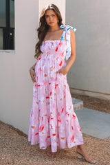 Vestido rosa largo con estampado floral y hombros anudados