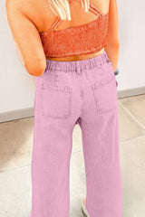 Jean large rose à taille haute, rivets et fentes latérales