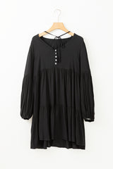 Black lace mini dress with puff sleeves and ruffles and buttons