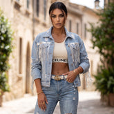 Veste en jean bleu ciel à franges et sequins