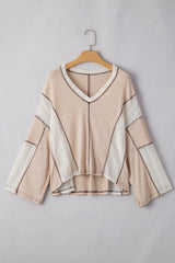 Top superior con detalles de crochet pergamino y costuras aparentes