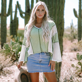 Grass green high low loose top with crochet details and exposed seams