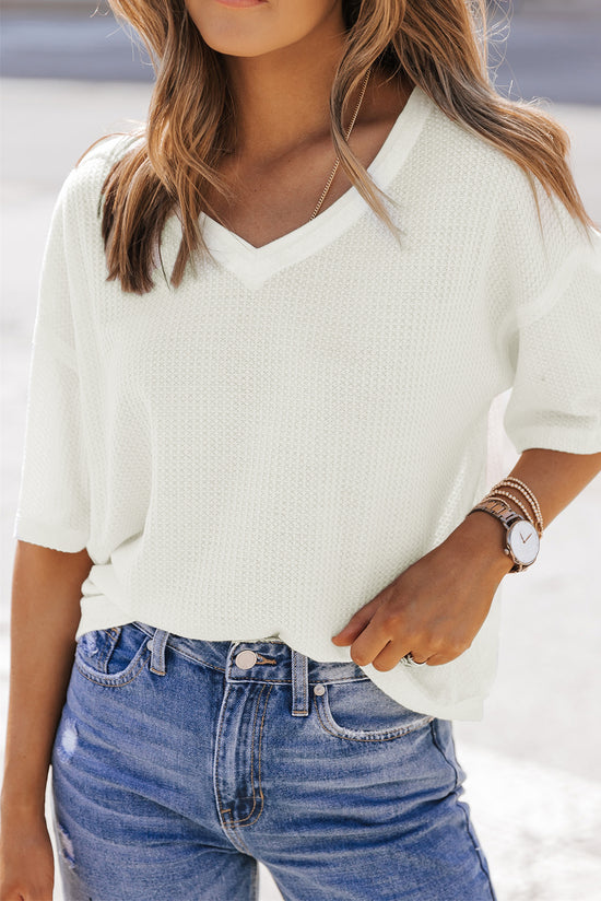 Ample white high in embossed knitting with drooping shoulders