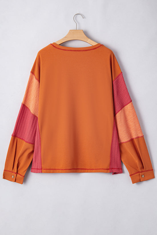 Haut orange en tricot texturé avec bloc de couleurs *