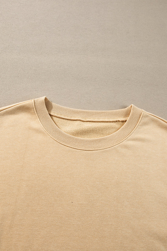 Sudadera beige beige francesa ligera, hombros caídos, cuello redondo y hendiduras