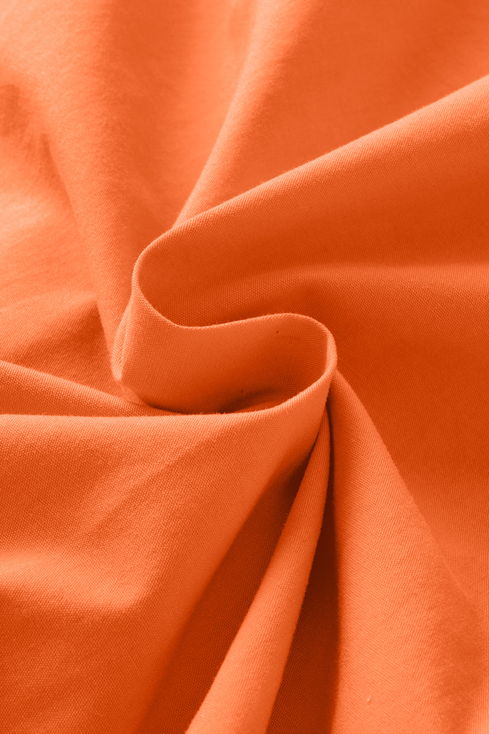 Blouse à peplum à manches courtes nouées orange nouée à l'orange nouée