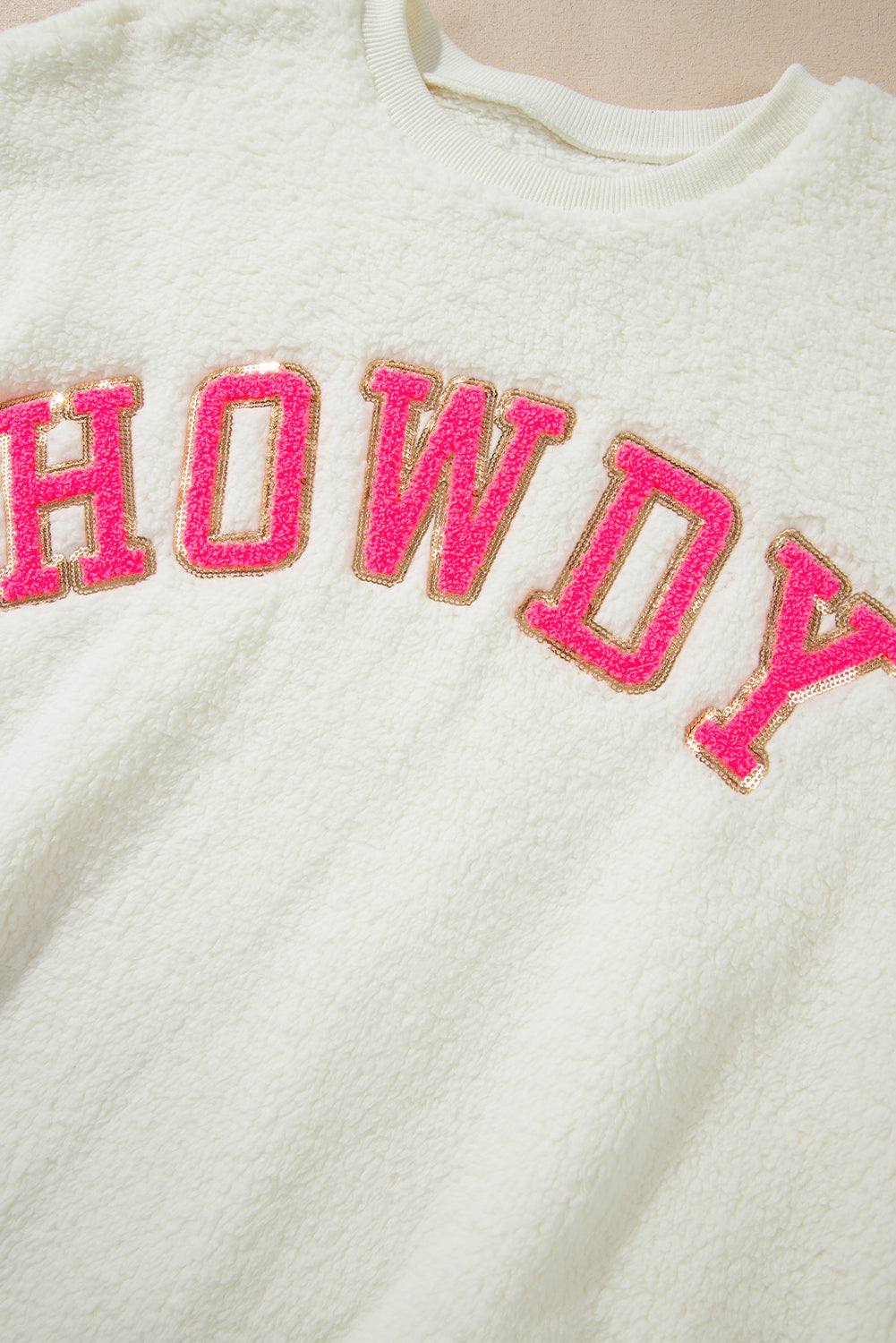 Sudadera sherpa howdy beige en parches