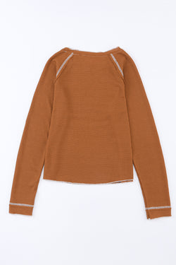 High textured brown with long sleeves and round neck *