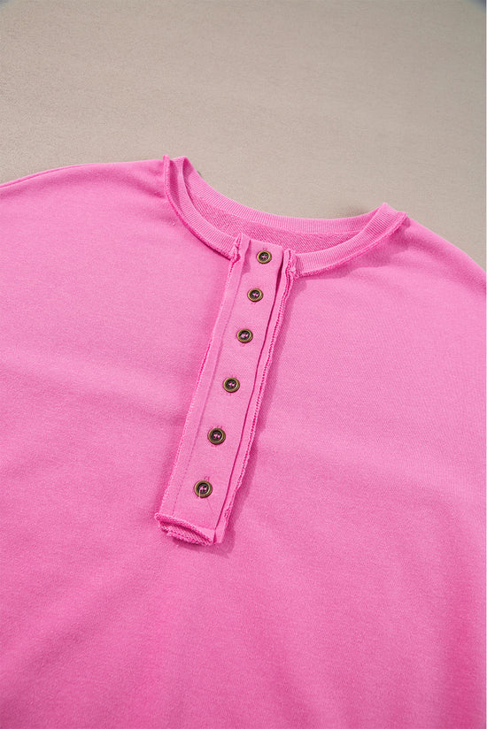 Henley sweatshirt with high and low hem in patchwork of candy sequins