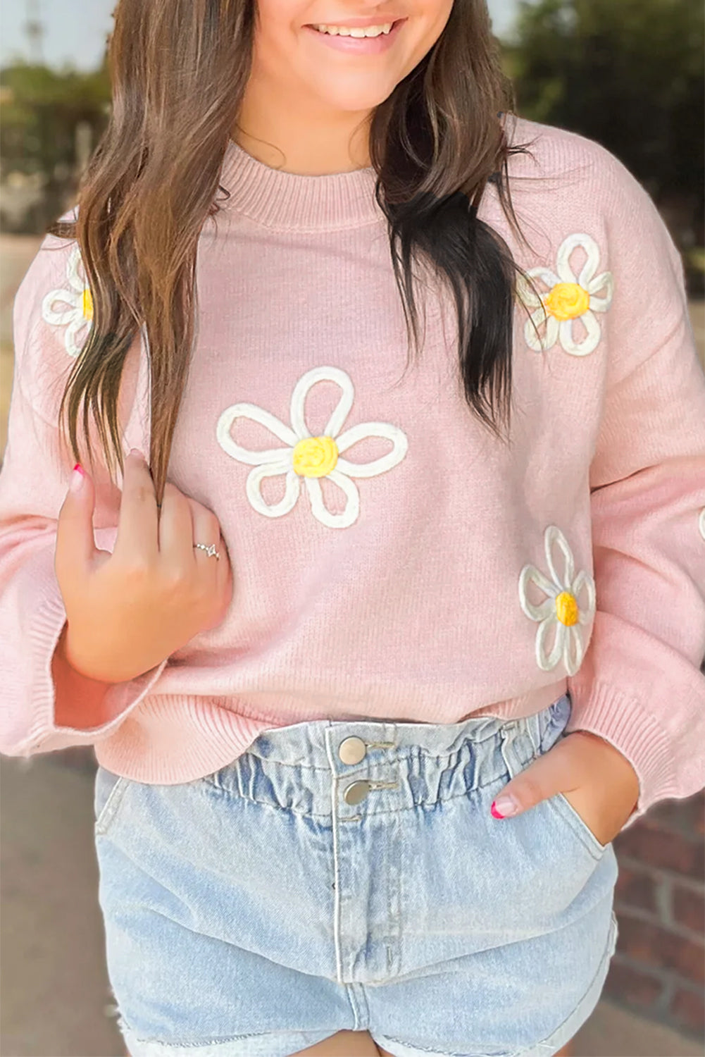 Pink chenille crew neck sweater with daisy stitching