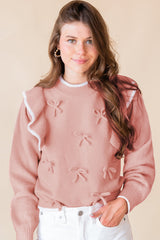 Pull à manches longues et bordure côtelée avec nœud papillon et volants rose clair
