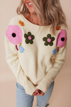 Beige knitted sweater with ribbed edges with flower pattern