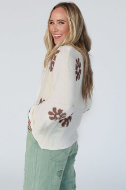 White round-neck sweater with color block floral pattern