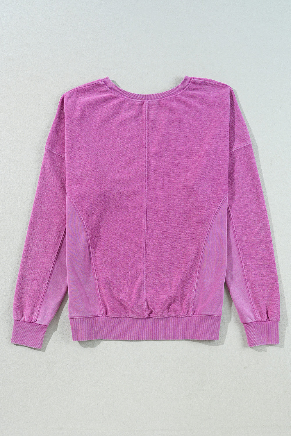 Hot pink sweatshirt with dropped shoulders and solid color notched collar