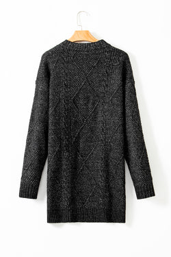 Large black sweater dress in twisted knitted with drooping shoulders