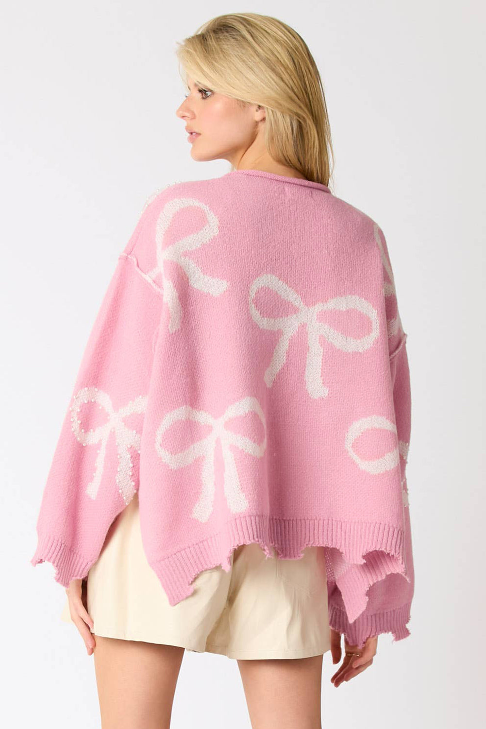 Pull à ourlet fendu en détresse à motif de nœud perlé rose