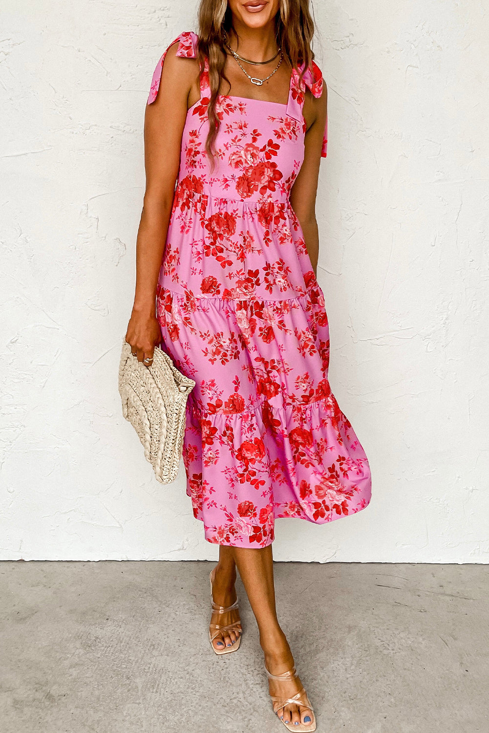 Pink floral dress with ruffles and tied straps