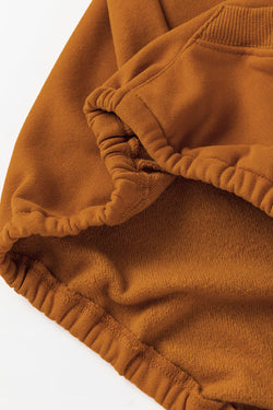 Brown zip-up hoodie with kangaroo pocket and ribbed trim