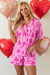 Pink pajama set with half-long sleeve shirt and node print shorts