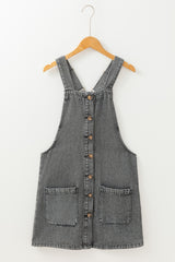 Mini-robe en jean gris moyen à larges bretelles boutonnées avec poches sur le devant