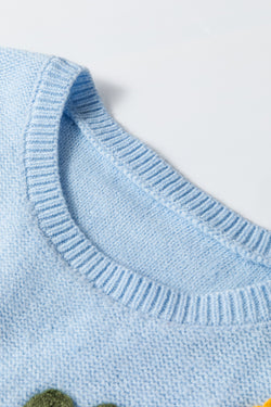 Light blue knitted sweater with ribbed edges with flowers pattern