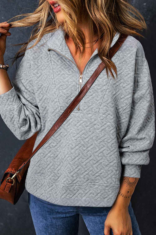 Grey textured half zip neck sweatshirt in solid color