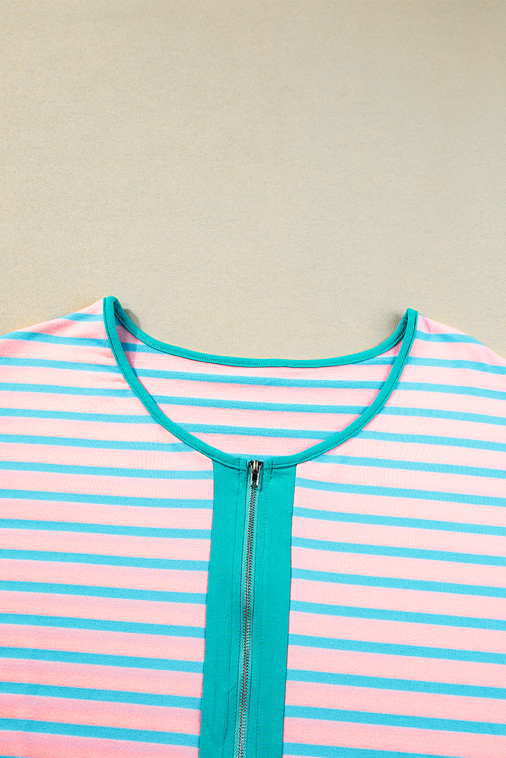 Short-sleeved and half-zip top with pink contrast stripes