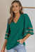 Green loose blouse with flared sleeve and v -collar