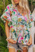 White blouse with short sleeves and ruffles with tropical floral print