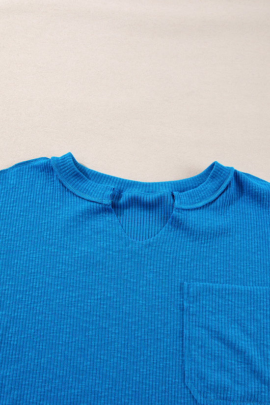 Blue long sleeve v-neck ribbed knit top with exposed seams