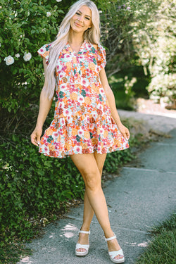 Purple floral print dress with split neck and flowing sleeves