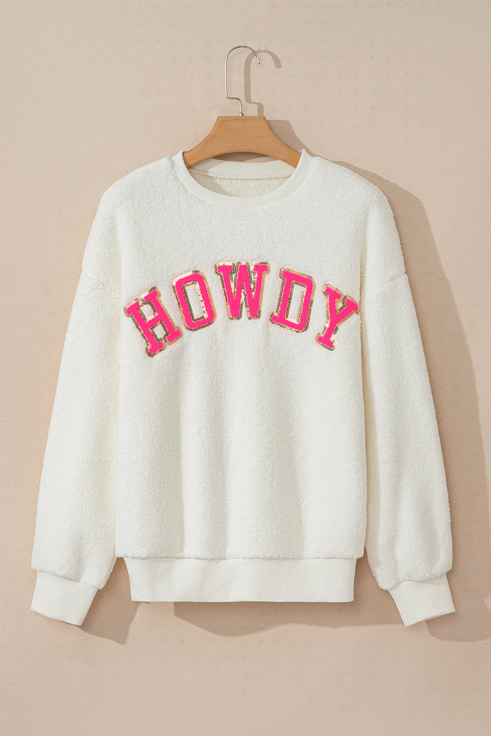Sudadera sherpa howdy beige en parches