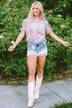 Pink blouse with floral print and buttoned, split collar, puffy sleeves