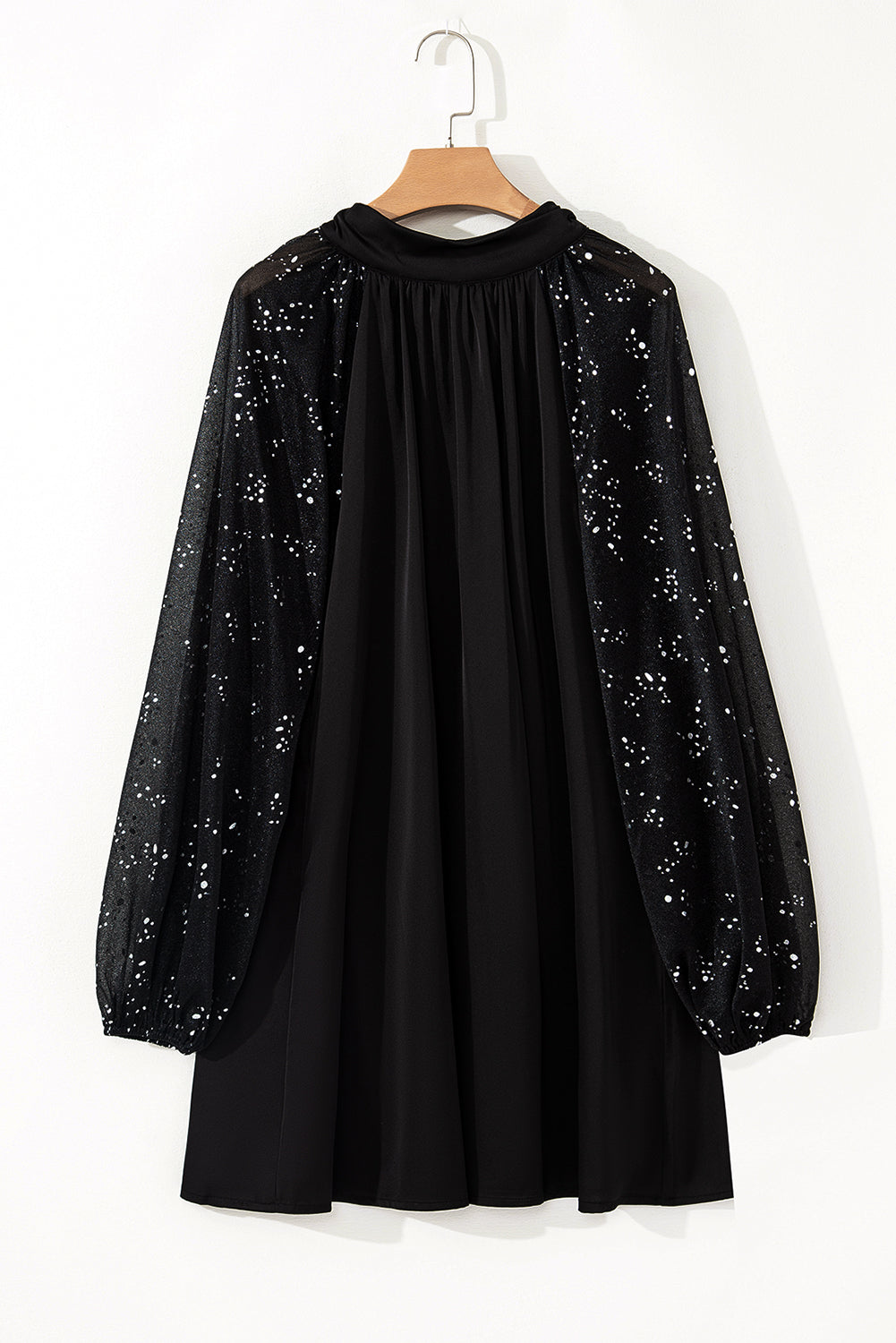 Black mini dress with shimmering mesh sleeves and high neck