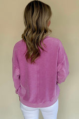 Hot pink sweatshirt with dropped shoulders and solid color notched collar