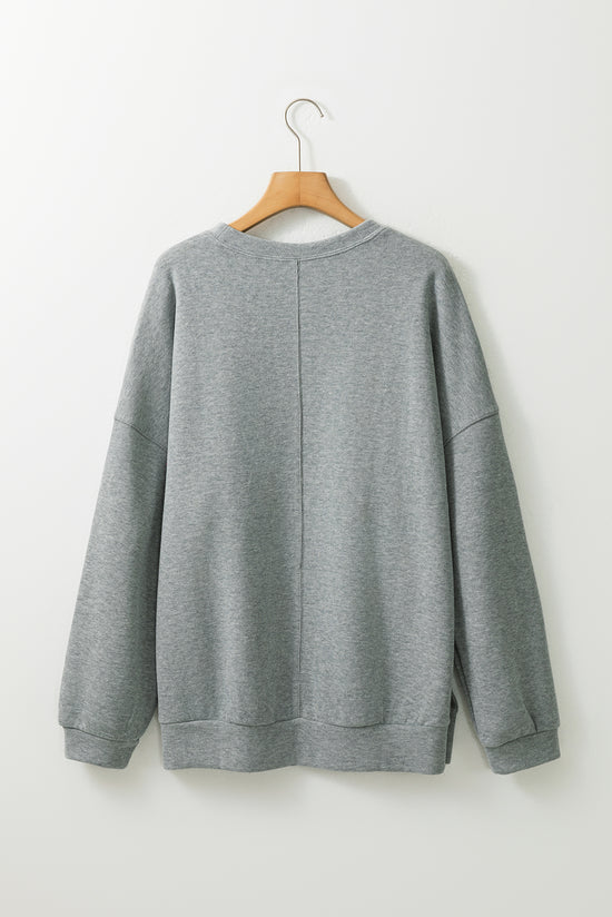 Middle-to-sloping gray oversized gray sweatshirt and side slit