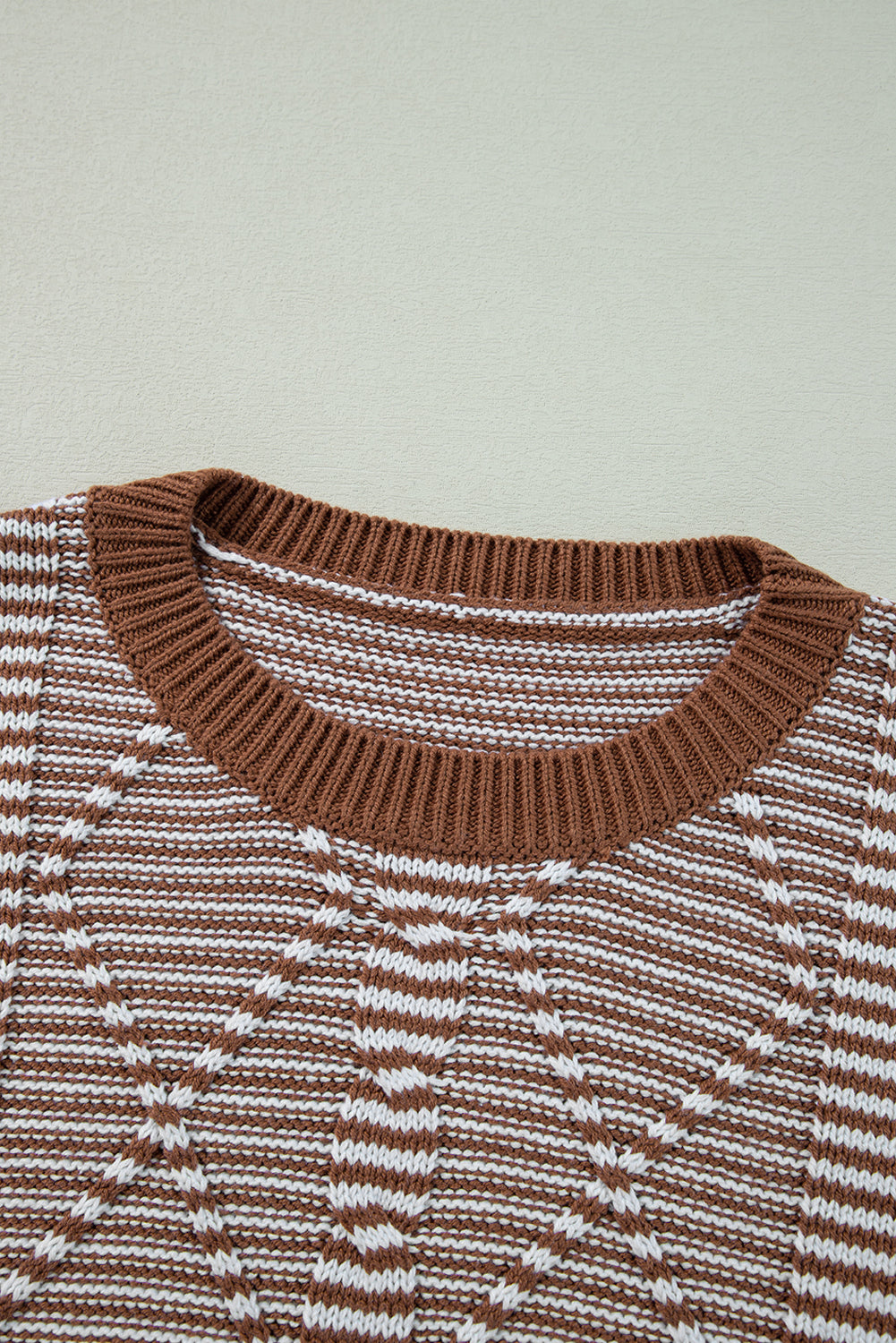 Brown sweater with textured geometric stripes and dropped shoulders