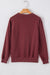 Solid burgundy sweatshirt with dropped shoulders and round neck