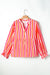 Orange striped blouse, balloon sleeves, notched v collar, buttoned on the front