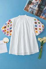 White top embroidered with smocked collar and puffy sleeves