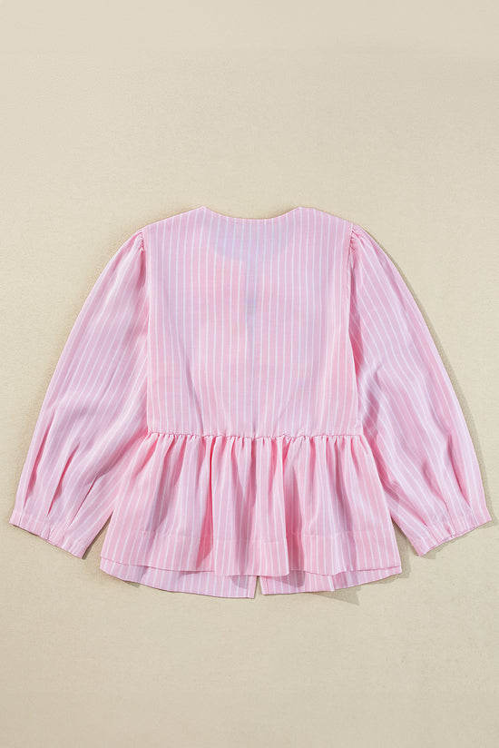 Striking pink blouse and bow tie on the front, round neck, puffy sleeves