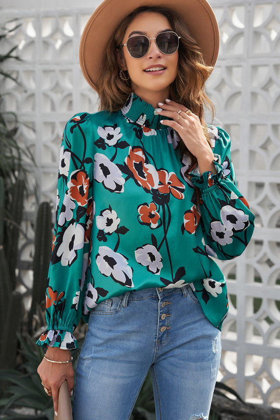 Smoked blouse with an upright collar and floral print