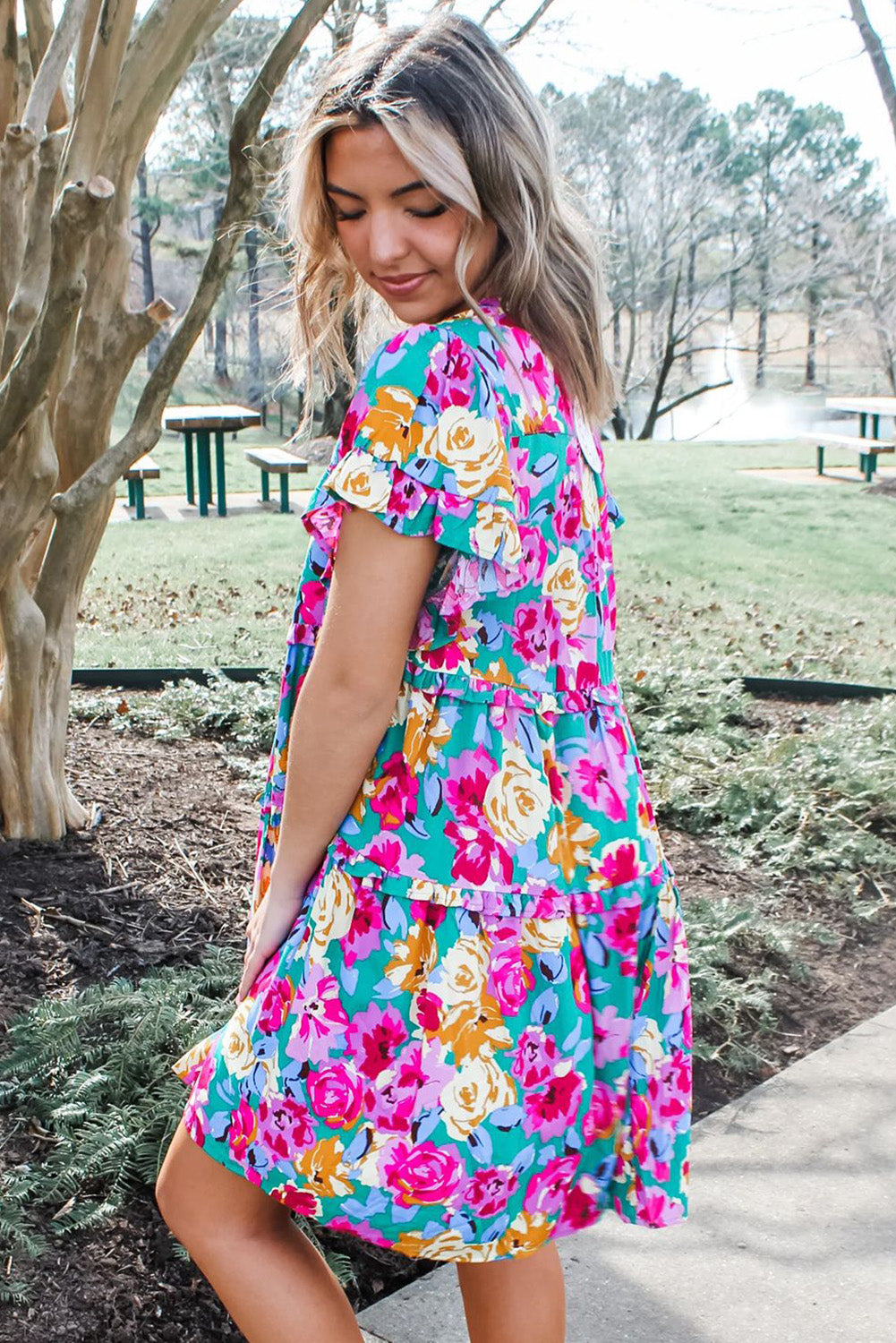 Short dress with ruffles and pink green floral print